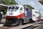 Commuter makes its station stop before shoving west